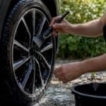 Hands washing ceramic coated alloy wheel carefully