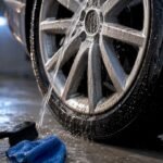 Brake dust being rinsed from alloy wheel