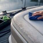 Marine vinyl seat being wiped clean