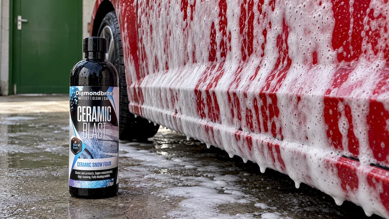 Clinging snow foam dwelling on a car panel